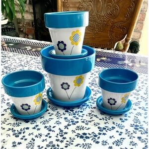 “New” (Set of 4) White Floral Design Ceramic Flower Pots With Blue Saucers.